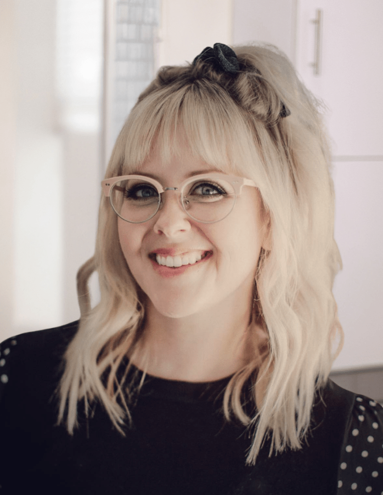 Danelle, blonding specialist and extension artist at Murraki Salon in Boise, Idaho, smiling during a professional salon headshot.